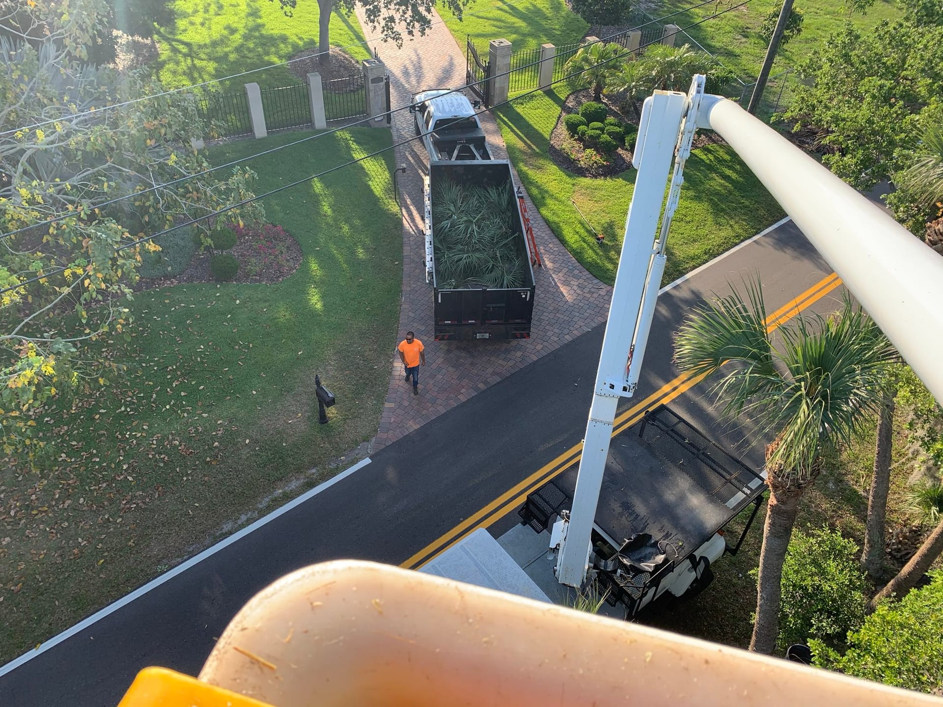 View from the bucket truck looking down a driveway during a job